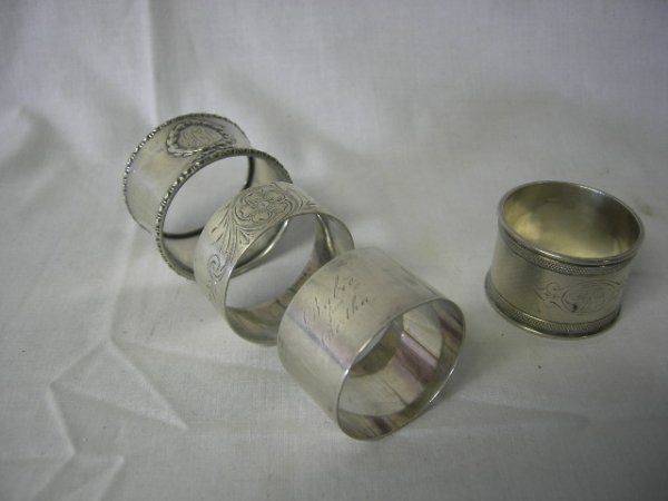 STERLING: 3 Sterling Silver Napkin Rings Inc Monogrammed GCL Encircled w/Raised Wreath, Marked B1546; Flower w/Scrolling Vine Monogrammed Mr JD, Marked 691; Monogrammed Babie From Bertha, Marked NG Wood & Son 9