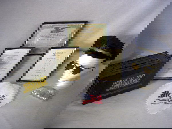 LAW ENFORCEMENT LOT: Law Enforcement Lot Inc. Metal 105 Cal.50 Ammo Box w/Handle, 3 Framed Certificates, Eagle Eyes Sunglasses In Metal Display Case, Neckerchief w/American Flag & Words "Proud To Be An American", & Vintag