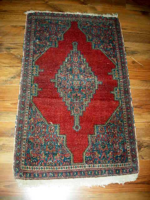 ORIENTAL MALAYER RUG: Iranian Malayer Rug with Red Center Field and Blue and Red Center Medallion and Spandrels. Cream Touches and Outlining. 1st Quarter 20th Century. 3'2" x 2".