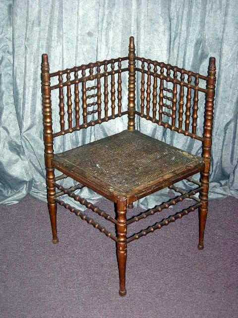 SIMULATED BAMBOO CORNER CHAIR: Corner Chair w/Charming Simulated Bamboo Decorated Sides, Stiles, Stretchers & Legs and Cane Seat. Bronze-Gold Finish.