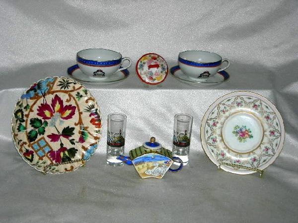 PORCELAIN & GLASS LOT: Porcelain & Glass Lot Inc. 2 Tea Cups Made In Hong Kong,;Colorful Scalloped Plate w/Oriental Design, 7.5"D; Rose Decorated Plate, 6.75"D; Miniature Tea Pot; Oriental Sugar Bowl Lid, 2.75"D; 2 Stoli Cl