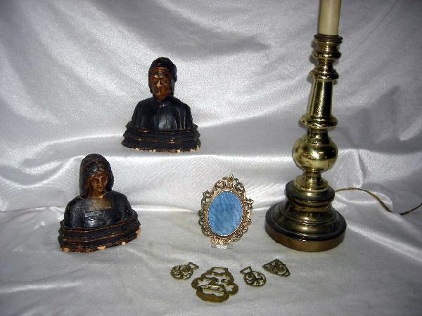 TABLE TOP LOT: Table Items Including Brass & Metal Lamp, Weighted Ceramic Bookend of Period Man and Woman Busts (Dante & Beatrice?, 7.25" Tall), Brass Oval Frame (5.25" Tall), 4 Brass Tabs of Varying Sizes (2.75" -