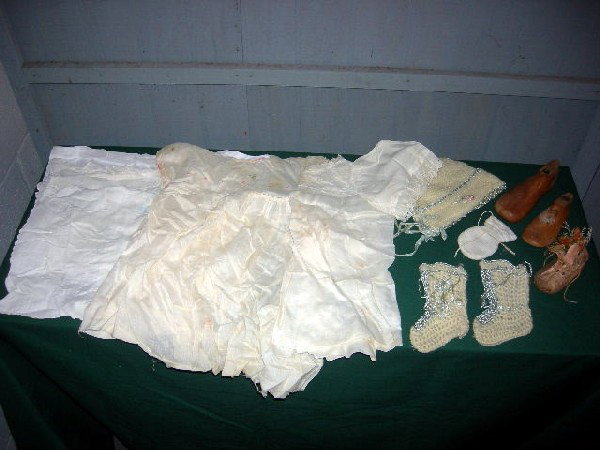 BABY CLOTHES ENSEMBLE: Baby Clothes Including Knit Bonnet and Booties w/Embroidery in Blue; Embroidered Dress w/Crocheted Collar; Dress w/Tatted Lace Collar and Lace Eyelet Sleeve Edges; 3 Baby Pillow Cases Including One w/
