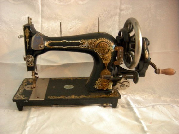 VINTAGE SEWING MACHINE W/HAND CRANK: 19th Century Sewing Machine w/Hand Crank, Black w/Gold Designs and Mother of Pearl, #2475307, 18" Wide x 8" Tall.