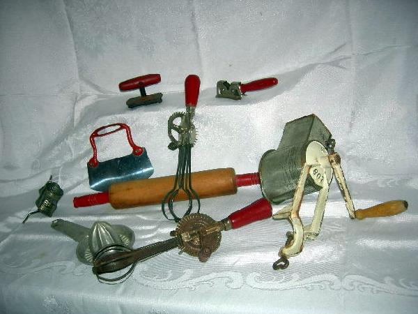 VINTAGE KITCHEN GADGET LOT: Lot Including 2 Table Top Grinders, 1 Marked A.S. 802; Red Handle Rolling Pin; 2 Red Handle Beaters; Chopper; 2 Can Openers; and Metal Foley Reamer. 3.5" to 15" Long.