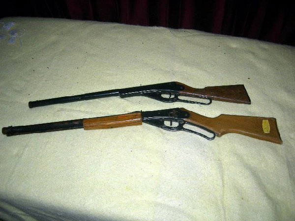 COLLECTIBLE AIR GUNS: Daisy Red Ryder No. 1938 Carbine BB Gun, Engraved Wood Stock, Reg K864940 and Daisy Model 1105 BB Gun, Plastic Stock.