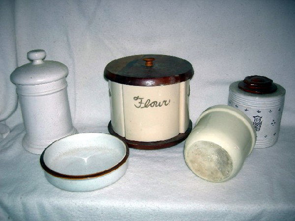 CERAMIC CANISTER LOT: Lot Includes Quartette of Pie Shape Bone Color Canisters Labeled Flour, Sugar, Tea & Coffee on Wooden Lazy Susan w/Wooden Lid; Antique White Crock Canister w/Brown Tulips, Tipp Novelty Co. Tipp City, 