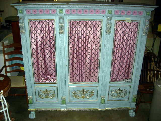 SPANISH CABINET: Pastel Blue Gilt Spanish Cabinet w/Flat Pediment Above Frieze, Applied Carved Rosettes, 3 Doors w/Wire Grill Panels Flanked By Lion Head Pillasters, & Lion Paw Front Feet, 19th Century, 76”W X 21”
