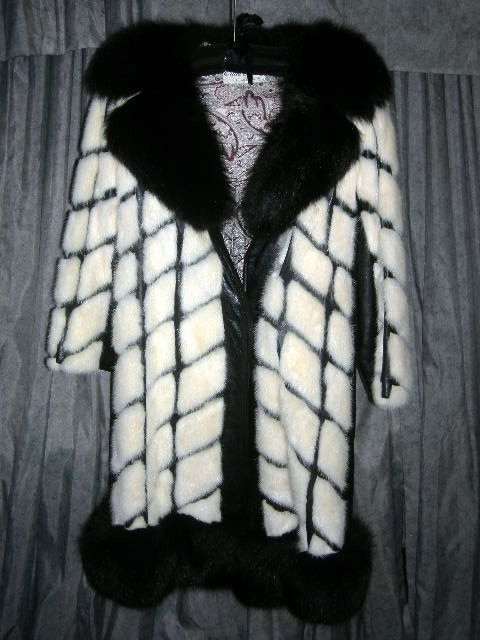 FURS - FOX TRIMMED MINK/LEATHER COAT: Black Fox Trimmed (Collar and Hem) Mink and Black Leather Block Pattern Coat with Silk Paisley Lining Novella New York, Milan, Erika Schon Furs, Philadelphia PA, 42" Long, 14.5" Interior Shoulder Widt