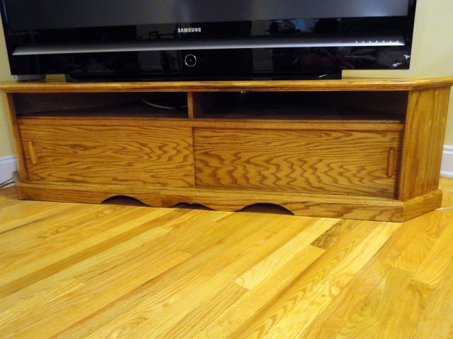 TELEVISION STAND: Hand Crafted Television Stand w/Upper Cupboard & Lower 2-Door Sliding Storage, Triangular Shape, 68"W X 40"D X 18"T.