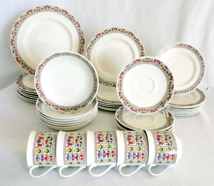 ROYAL DOULTON DINNERWARE: "Fireglow" Fine China Made in England Including 7 Dinner Plates, 6 Salad Plates, 6 Bowls, 8 Bread & Butter, 5 Cups & Saucers. White Ground w/Multi Spring Flower Border.