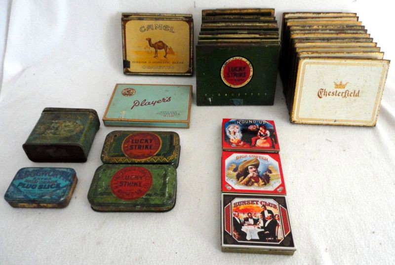 30 VINTAGE CIGARETTE/TOBACCO TINS: Lot of Tins Includes 11 Chesterfields, 11 Lucky Strikes, 2 Camels, Dick Custer, The Round-Up, Champagne Sparklets, Edgeworth Extra High Grade Plug Slice.