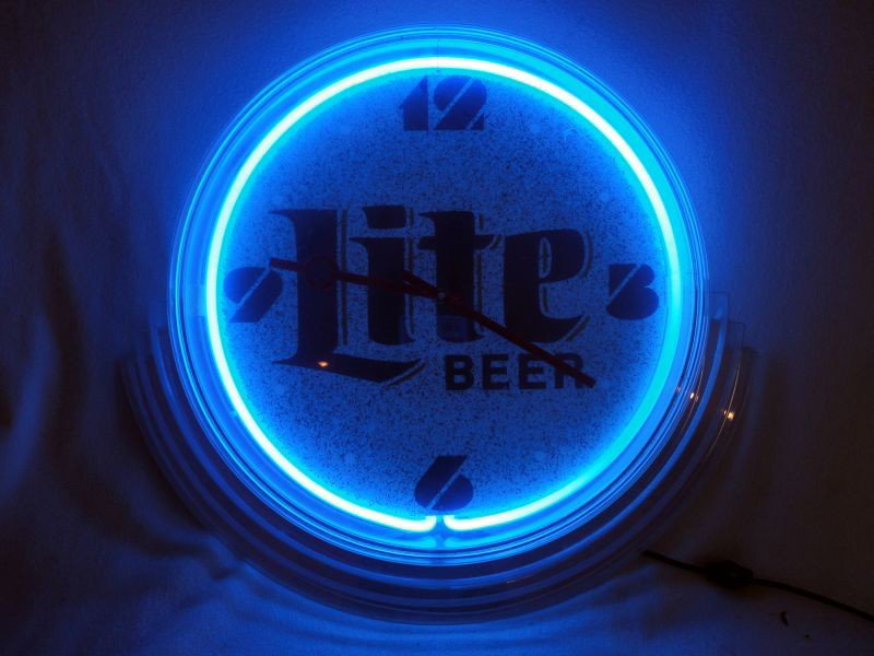 MILLER "LITE" NEON CLOCK: Miller Lite Lighted Working Clock, 21"W X 19"T.