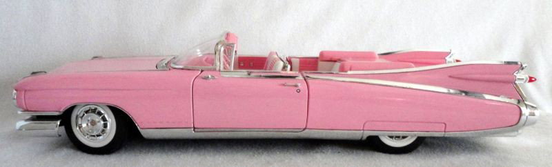 PINK MODEL CADILLAC: Pink Model Cadillac 1959 "Maisto" Pink Model Cadillac, 1/12 Scale. Hood, Trunk and Doors Open, Steering Wheel Rotates Tires, 6.5" W X 19" L.
