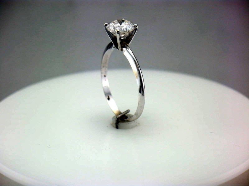 14 KARAT DIAMOND SOLITAIRE RING: Diamond Ring w/Round Brilliant Cut 1.67 Carat Solitaire Diamond in White Gold Mounting. Diamond Colorless (F), Clarity I(1). International Gemological Information Card dated 5/19/97, Retail Replacemen
