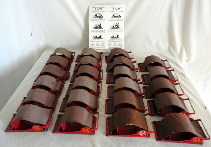 ROLL YOUR OWN LOT: Roll Your Own Lot Inc. 23 "Buckhorn Liggett & Myers Inc." & 1 "Brown & Williamson Products" Cigarette Rollers All Metal w/Vinyl Rolling Surface, w/Directions For Operating, 6"L X 2.5"T.