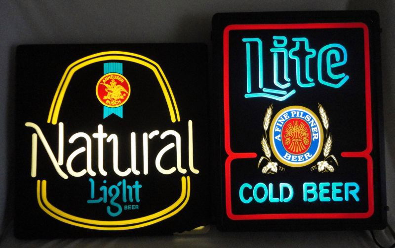 TWO NEON LIGHTED ADVERTISING BEER SIGNS: Two Neon Advertising Beer Signs Inc. "Lite A Fine Pilsner Beer, Cold Beer" (Blue & White Letters On Black Background), 15"W X 19"T; "Anheuser Bush Natural Light" (Yellow, White and Blue Letters On Bla
