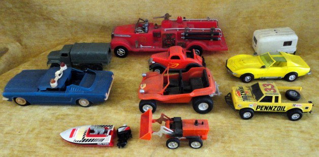 COLLECTIBLE CHILDRENS VEHICLES: 10 Collectible Children's Vehicles Inc. Red Fire Engine, Orange "Gay Toys" Dune Buggy, Teal Mustang Police Cruiser, Yellow Corvette, White U-Haul Trailer, Orange 1936 Ford Coupe, Yellow Lanard Toys Pe
