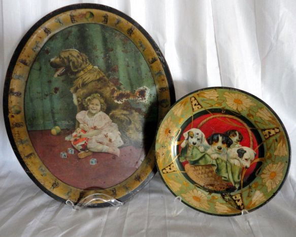VINTAGE TIN ART: Vintage Tin Art Inc. Large Oval Tray Center Child w/Dog Alternating Toy Rim, 17"L; & Round Plate Basket Of Puppies Center w/Daisy Pattern Rim, 9.75"D.