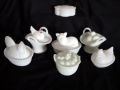 COVERED MILKGLASS LOT: Lot Includes 7 Pieces: Covered Egg Nest w/Hatchling (3.5" T), Oval Basket w/Chick on Cover (3.75" T), a Decorative Box Marked 26 (4" L), Basket w/Cat (5.5" L), Oval Basket w/Rooster Lid Having Red Pai