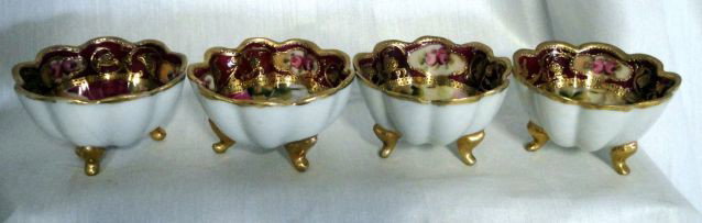 FOUR NIPPON NUT DISHES: Beautifully Hand Painted Scalloped Edge Nut Dishes on Four Feet, Gold Trim, Nippon Mark on Bottom, 2.75" D x 1.75" T.