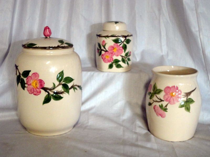 THREE PIECES DESSERT ROSE ACCESSORIES: Lot Includes Franciscan Dessert Rose Covered Cookie Jar, 11" T; Open Utensil Holder, 7" T and a Covered Caddy, 6" T.
