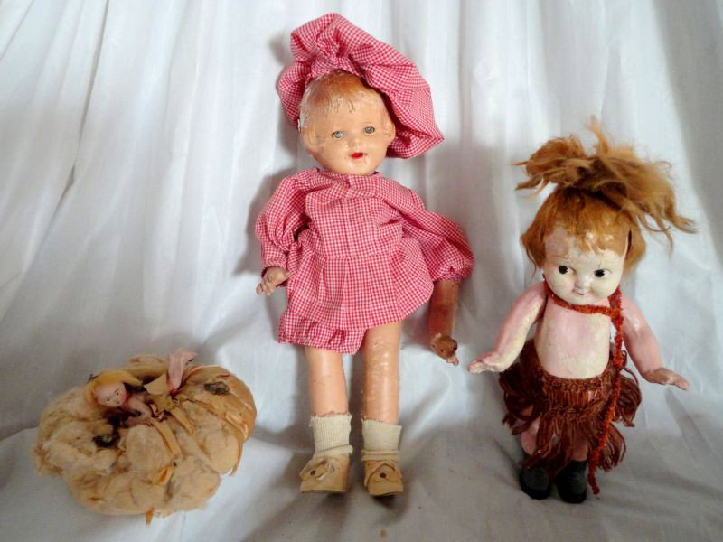 TRIO VINTAGE COMPOSITE DOLLS: Two Dolls: One Gyrating Wind Up Hula Girl in Native Dress (12.5" T) and Young Girl Doll (17" T), Plus Pin Cushion Angel ( Moveable Arms, 3.5" L).