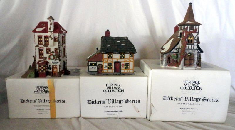 THREE PIECES DICKENS' VILLAGE SERIES CHRISTMAS: Lot Includes Lighted Dept. 56 Heritage Village Collection "C.H. Watt Physician," 8.25" T; "Mr. & Mrs. Pickle," 6.5" T; and "Old Michael Church," 9" T. Original Boxes and Cords.