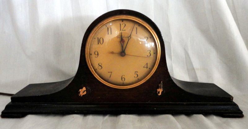 TELECHRON NAPOLEON HAT CLOCK: Mahogany Electric Warren Telechron Clock Model 563, 17" W x 7" T.
