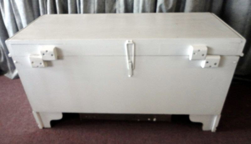 WHITE PAINTED CAVALIER CEDAR CHEST: Decoratively Trimmed Cavalier Cedar Chest with Waterfall Lift Lid, Raised Half Felt Lined Shelf and Hidden Drawer in Base, 44" W x 18.5" D x 24.5" T.