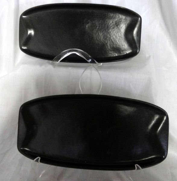 TWO ROSEVILLE RECTANGULAR DISHES: Black 5" W x 10" L Plates with Raised Ends on 5 Feet, Marked 159 Raymor by Roseville USA.