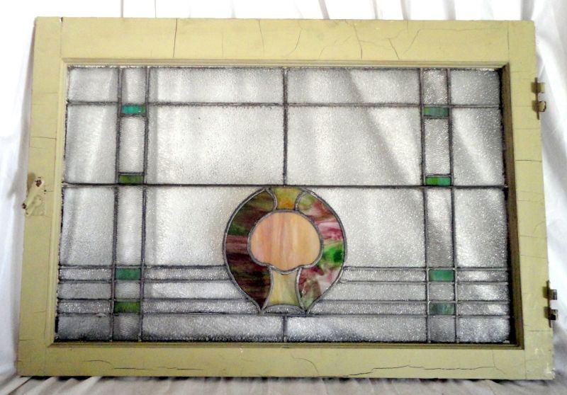 STAINED GLASS WINDOW: English Stained Glass Window, Yellow & Green, Circular Design w/Tree Form Surrounded By Pebble & Green Glass In Criss-Cross Pattern, Framed w/ Painted Wood, Latch & Hinge Hardware, 36”W X 24.5”T
