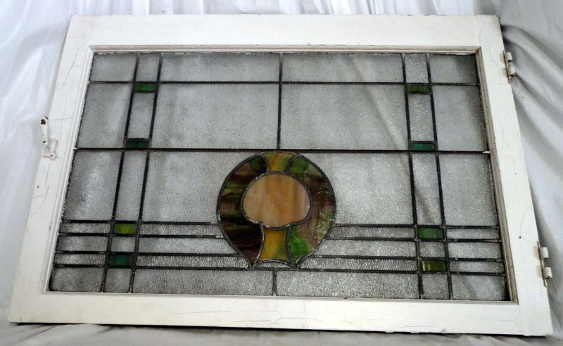 STAINED GLASS WINDOW: English Stained Glass Window, Yellow & Green, Circular Design w/Tree Form Surrounded By Pebble & Green Glass In Plaid Pattern, Framed w/ Painted Wood, Latch & Hinge Hardware, 36”W X 24.5”T.