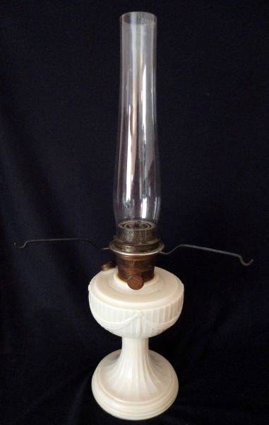 MILK GLASS FEDERAL STYLE OIL LAMP: Paneled Lamp has Font w/Drapery & Tassel Trim, Wick Knob Marked Aladdin, Font Lid Marked Mantle Lamp Co., Nu-Type Model B, Chicago, Illinois USA, 23.5" T.