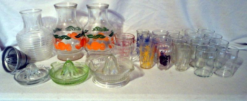 RETRO GLASS KITCHEN LOT: Including: 4 Juice Bottles, (2 Painted) 7.75 – 8.75"T; 3 Glass Reimers, One Green; Aluminum Juicer; 2 Pyrex Measuring Cups; 19 Juice Glasses, 6 Painted