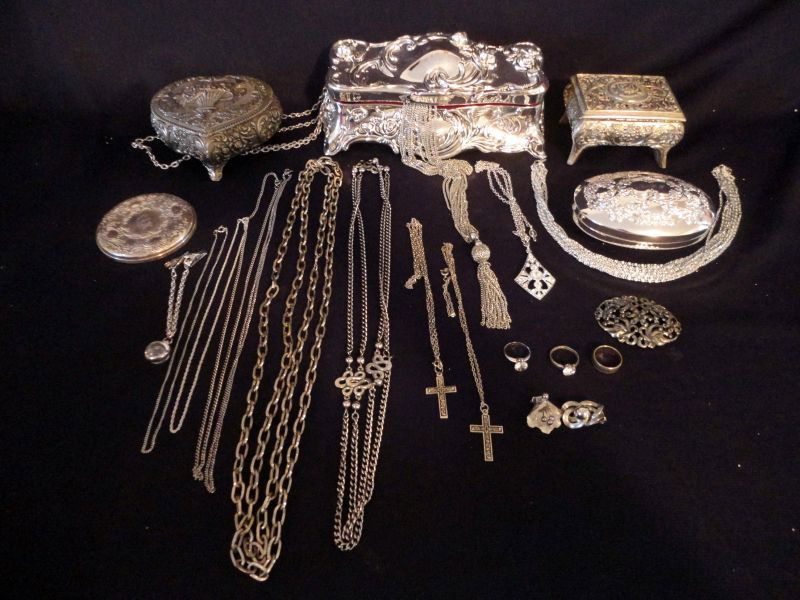 SILVER TONE JEWELRY & STORAGE LOT: Lot w/Silver Plated Jewelry Boxes Including One 9" L Embossed Box, Engraved & Plated Mirror, Metal Heart Box. Jewelry Includes 3 Rings, 5 Chains (1 w/Pendant), Rhinestone Shoe Clips, 6 Necklaces (1 w/
