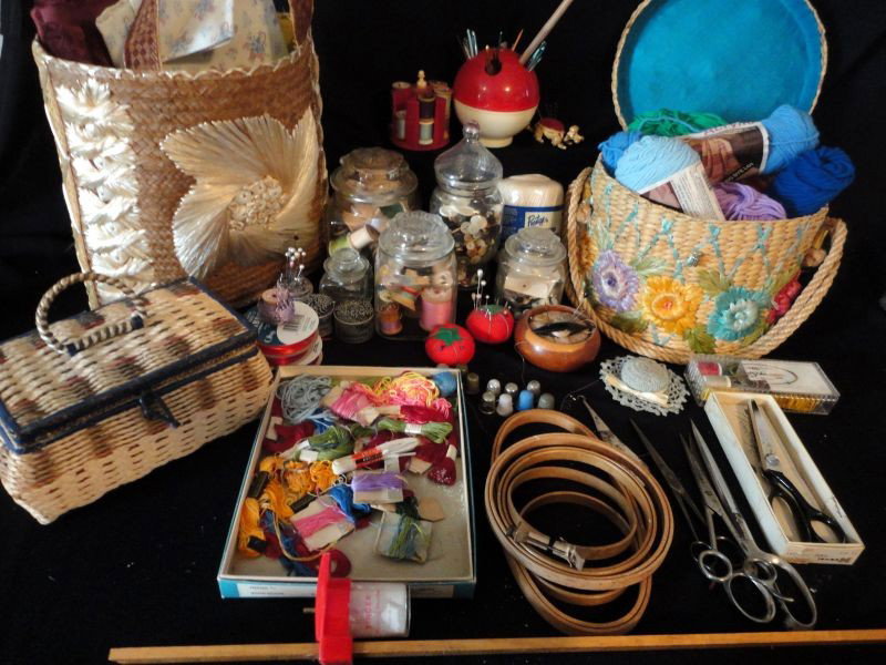 SEWING LOT: Including: 3 Wood Hoops, Floss, 2 Jars Wood Spools, 2 Jars Buttons, 8 Pin Cushions (One Poodle w/Bobble Head), Ribbon, Basket of Fabric, Basket w/Lid of Yarn, Sewing Box w/Thread, 11 Thimbles, Crochet