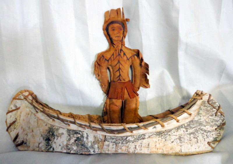 BURCH CANOE WITH INDIAN: Hand Crafted, Burch Canoe, Sewn Together w/Leather, 18"L; & Leather Native American Doll, Features Painted In w/Ink, Fringed Sides, 13"L.