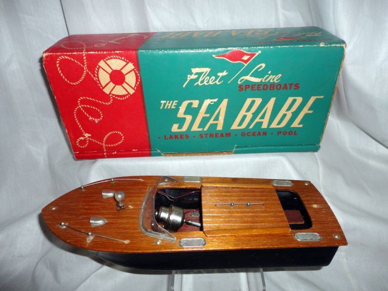 VINTAGE FLEET LINE SEA BABE SPEEDBOAT: 1950 Battery Powered Speedboat w/Original Box, Top Wood, Cellophane Windshield, Box Printed Fleet Line Speedboats The Sea Babe, The Fleet Line.14728 Keswick St. Van Nuys, California, 12.5"L.