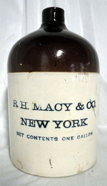 R.H. MACY CROCK: Bone Jug w/Brown Top, Blue Lettering, RH MACY & CO. NEW YORK NET CONTENTS ONE GALLON, Cork Stopper, 11"T.