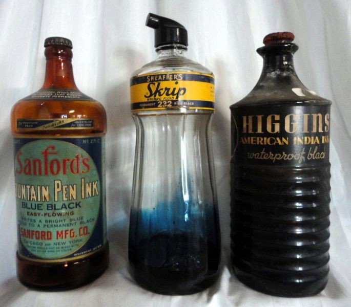 THREE VINTAGE MASTER INK BOTTLES: 3-32 Oz. Paper Labeled Bottles Inc. Clear "Higgins American India Ink Waterproof Black," w/Cork Top, 9.5"T, Brown "Sanford's Fountain Pen Ink Blue Black," w/Metal Spout, 9.75"T, & Clear "Sheafper's Sk