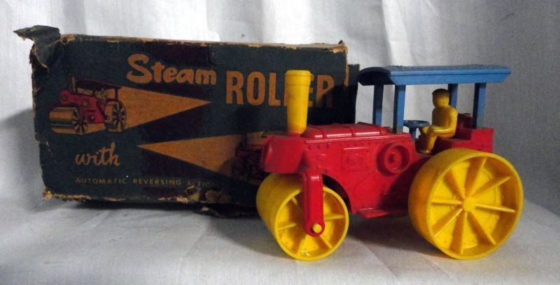 ARCHER PLASTICS STEAM ROLLER: Archer Plastics Steam Roller w/Original Box, Red w/Blue Top, Yellow Wheels & Roller, Wind up Rubber Motor Moves Forward & Back Automatically, 4.5"L x 3"H.