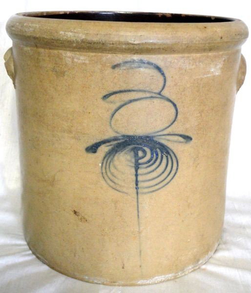 BLUE BEE CROCK: Large Honey Color Crock, 7"Blue Bee On Front, w/Applied Tab Handles, Dark Brown Interior, 10"D X 10.5"T.