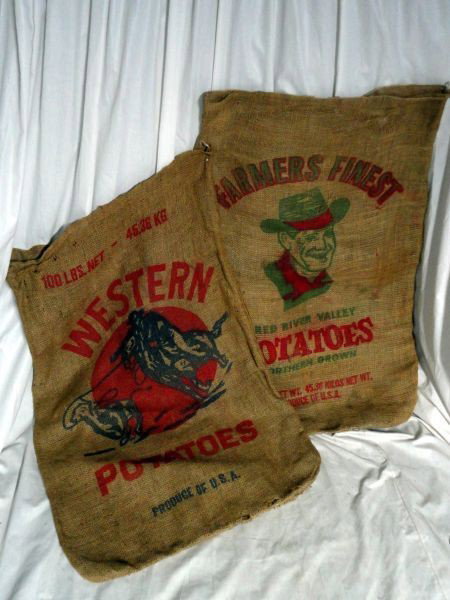 TWO BURLAP POTATO SACKS: Lot Inc. "Farmers Finest Red River Valley Northern Grown Potatoes" w/Smiling Cowboy "Product Of USA" & "Western Potatoes" w/Roping Cowboy Motif, Back Lettered "Don't Throw Don't Drop Don't Bruise Pota