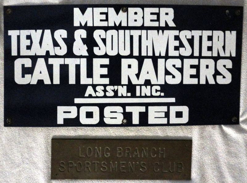 METAL SIGN LOT: 2 Metal Signs Including: Brass "Long Branch Sportsmen's Club", 3.5"W x 12"L; Blue Painted Metal w/White Lettering "Member Texas & Southwestern Cattle Raisers Ass'n. Inc. Posted, 10"W x 20"L, Both Have