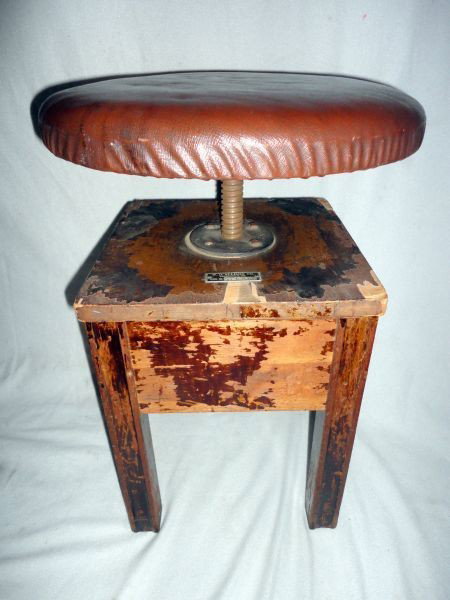 W. D. ALLISON CO. VINTAGE PIANO STOOL: Lot Inc. Wood Piano Stool Metal Tag “W.D. Allison Co. Indianapolis Ind.” Square 4 Legged Base w/Round Brown Leatherette Covered Adjustable Height Seat, Serial # L 3203, 21”T.