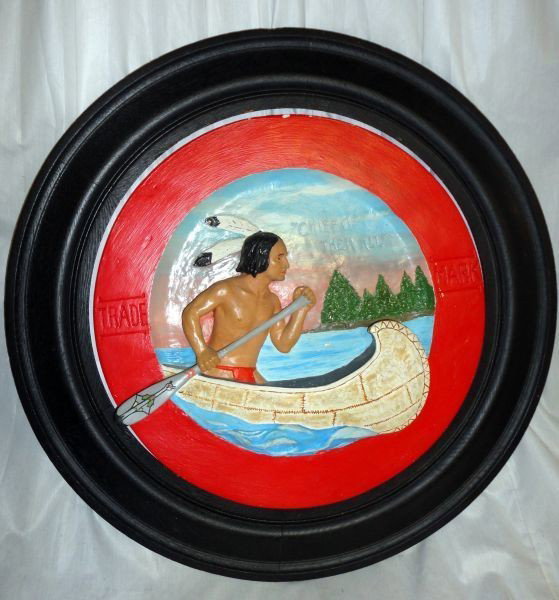 SAMOSET PLASTER ADVERTISING RING: Round Chocolate Ad, Colorful Painted, Plaster 3-D Ring Depicting Native American In Canoe, On Water, Wide, Red Border Inscribed Trade Mark, Sky Is Carved w/Words "Chief Of Them All," w/Round Wood Fram