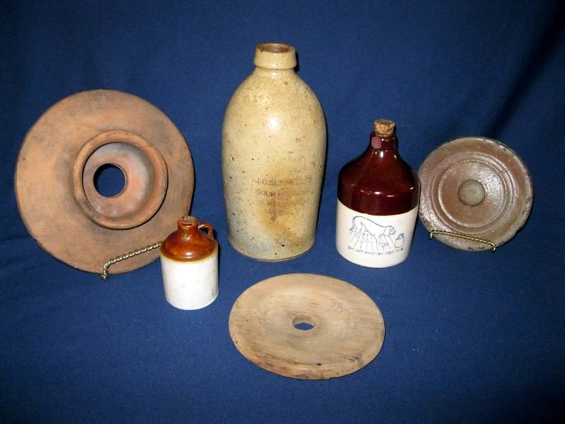 VINTAGE CROCK & JUG LOT: Inc. Stoneware Bottle Engraved J.C. Schnell's Sour Mash Kiln Dried Whiskey, 8.5”T; 2 Miniature Crock Jugs w/Brown Top, (One Has Hound Dog & Verse “She Ain't What She Used To Be,”); & 3 Lids: Two