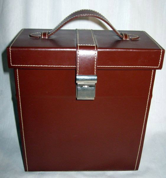 RED ENVELOPE PORTABLE BAR - LIKE NEW: Lot Inc. Brown Case, 9.5”T, Containing 10 Stainless Steel Pieces: Covered Shaker, 2 Screw Top Flasks, 4 Shot Glasses, Bottle Opener, & Stir Spoon.