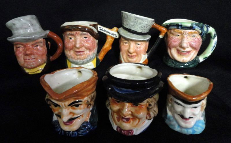 TOBY JUG LOT: 7 Miniature Toby Jugs Including: 3 Lancaster & Sandland “Scottie” & 2 Character Jugs, 1 Painted Sign “To Widdicombe”, 2 Marked Lancaster & Sandland LTD Hand Painted in England Modeled and Desi